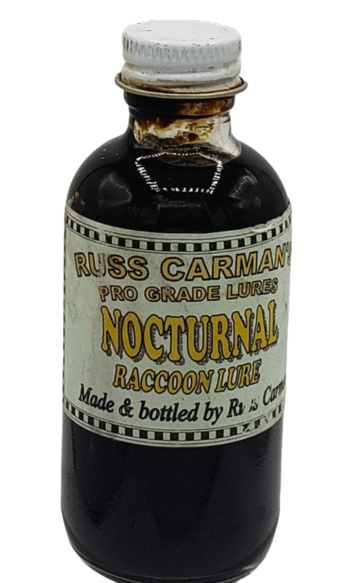 A screw-capped bottle labeled "Carman's Pro Grade Nocturnal Lure" contains dark liquid.