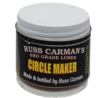 Jar of Carman's Pro Grade Circle Maker Lure, premium coyote lure with a white screw-on lid and black label.