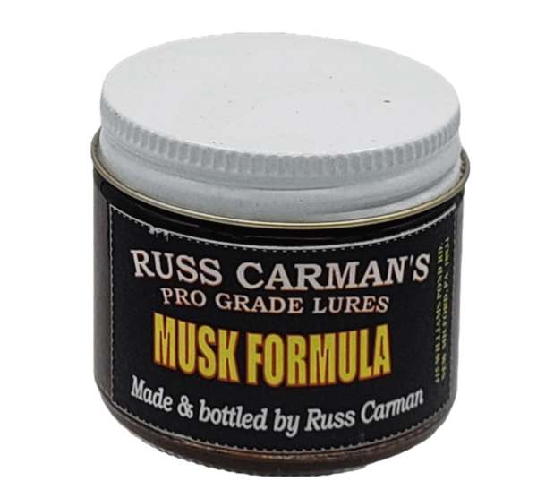 A jar of Carman's Pro Grade Musk Formula by Russ Carman, featuring a white lid.