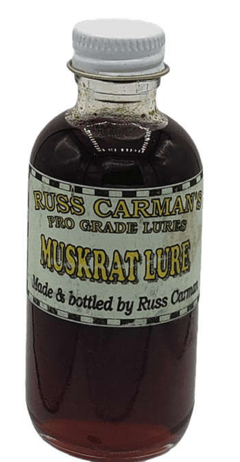 Carman's Pro Grade Muskrat Lure comes in a bottle with dark liquid and a white cap.