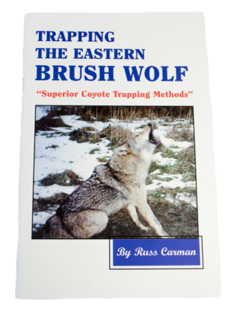 Book cover: "Trapping the Eastern Brush Wolf" by Russ Carman, with a wolf in a snowy field.