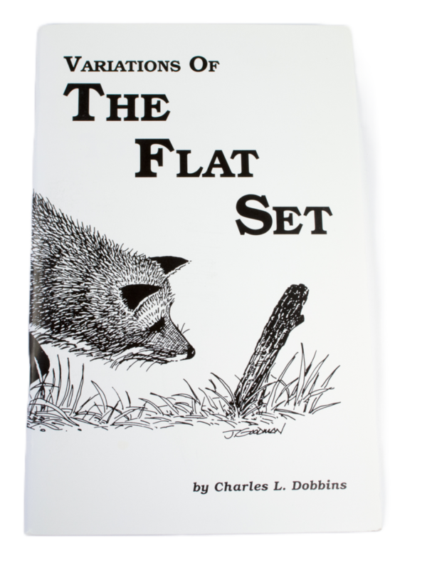 Book cover titled "Charles Dobbins - Variations of the Flat Set," with a fox near a stick in grass; ideal for trappers.