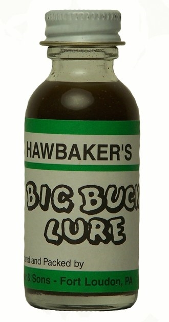 A small "Hawbaker's Big Buck Lure" bottle with green and white packaging for attracting deer.