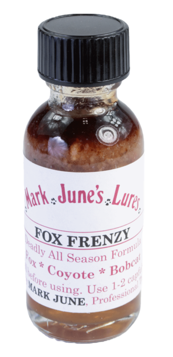 Small bottle labeled "Mark June's Fox Frenzy Lure," for attracting foxes, coyotes, and bobcats.