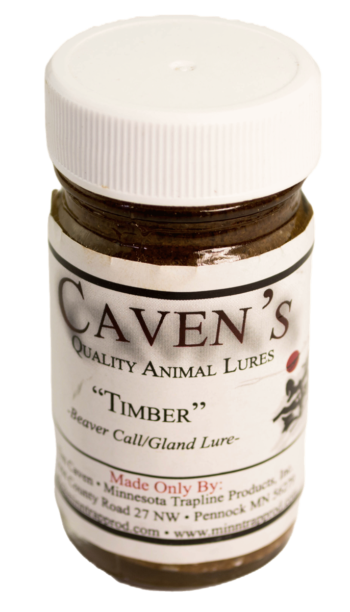 A jar of Caven's Timber Lure by Minnesota Trapline Products with a white lid and label.