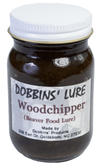 A jar of Dobbins' Woodchipper Lure, labeled "Beaver Food," from Goldsboro, NC.