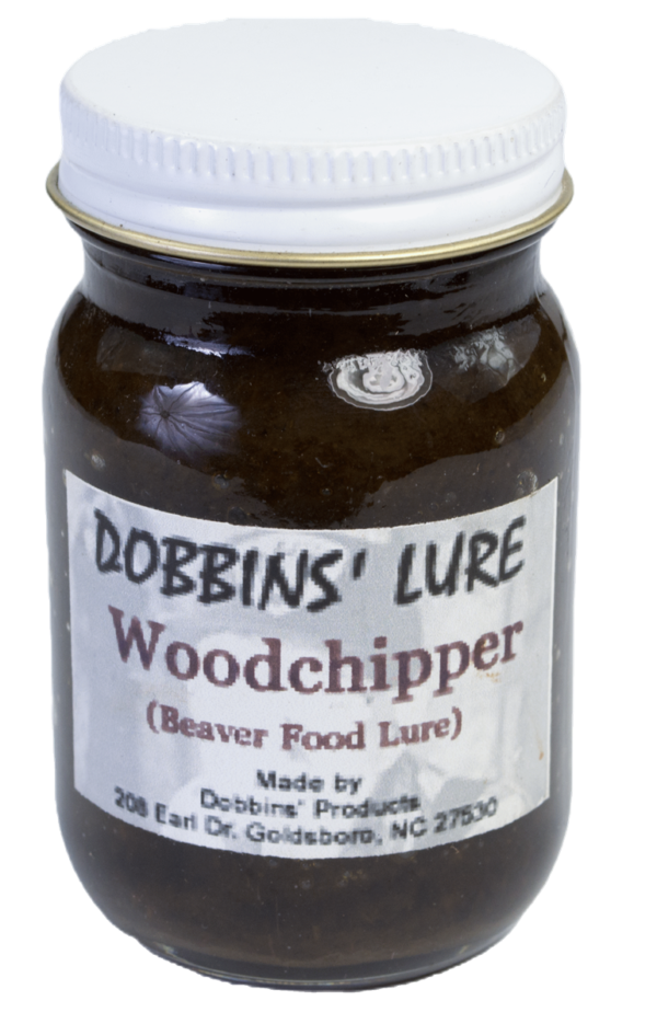 A jar of Dobbins' Woodchipper Lure, labeled "Beaver Food," from Goldsboro, NC.