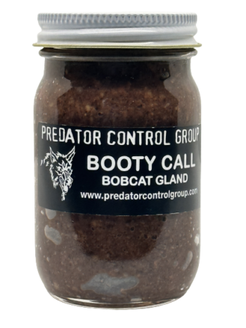 A jar labeled "PCG Booty Call Bobcat Gland Lure" features a wolf logo and website URL on the label.