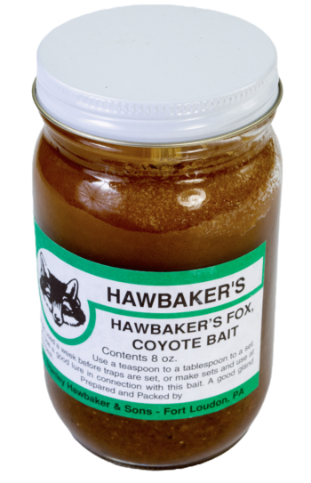 Glass jar labeled "Hawbaker's Fox & Coyote Bait," trapping bait with green sticker; contains 8 oz of effective bait.