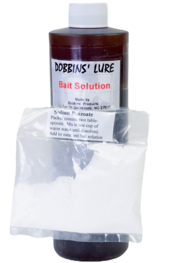 Dobbins' Bait Solution bottle includes sodium benzoate packet under label for optimal canine lure.