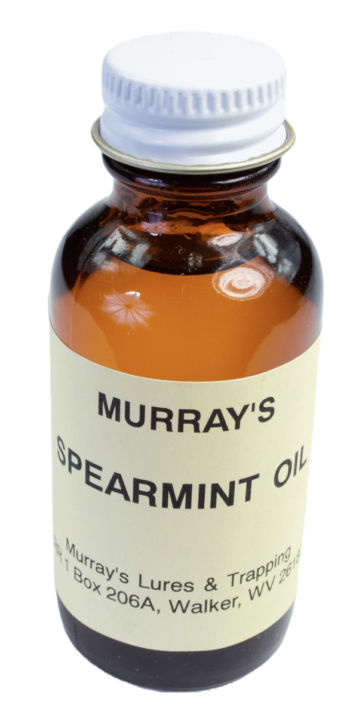 Small brown glass bottle labeled "Murray's Spearmint Essence Oil" with a white cap.