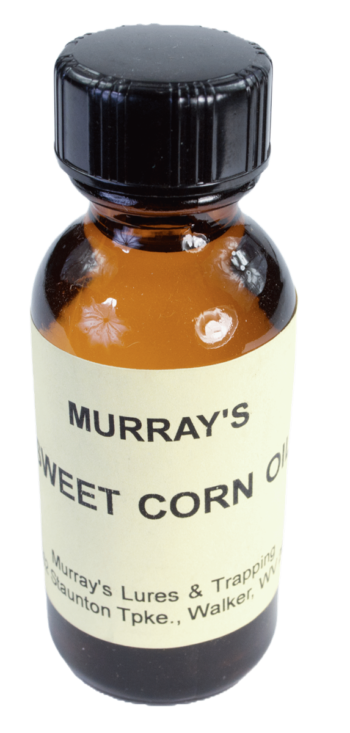 Amber bottle labeled "Murray's Sweet Corn Essence Oil," for lures and trapping, from Walker, WV.