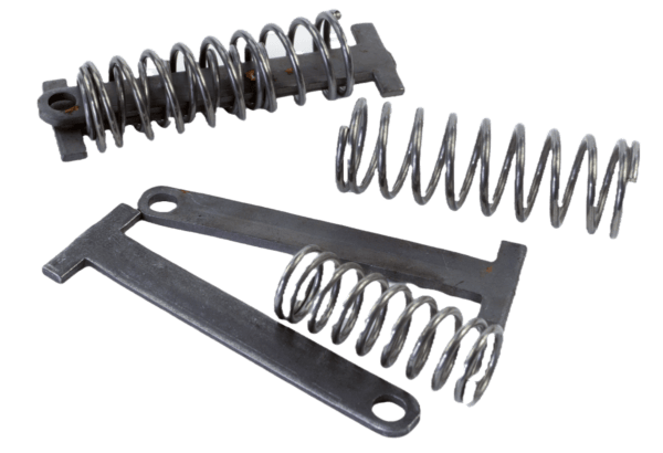 Two metal coil springs with brackets and a Sleepy Creek In-Line Spring on a plain background.