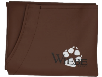 Brown "Wiebe" fabric with a white bear paw print logo, from the Heavy Duty Wiebe Brown Skinning Apron.