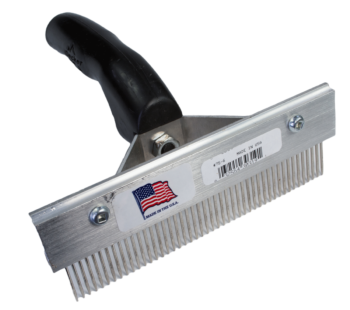 Heavy Duty Fur Comb with a black handle, metal teeth, and an American flag sticker.