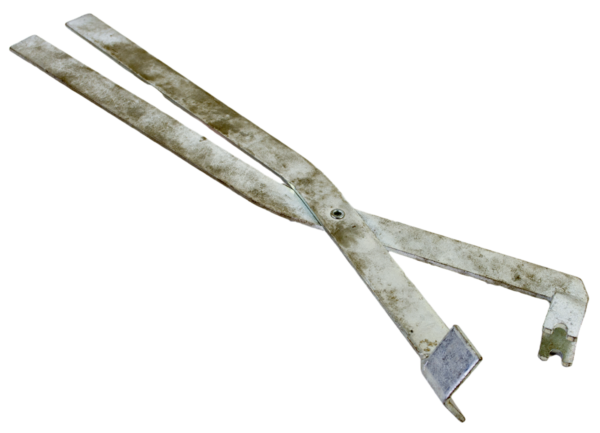 Trap Tweezers, resembling large rusted pincers with flat ends, isolated on a white background.